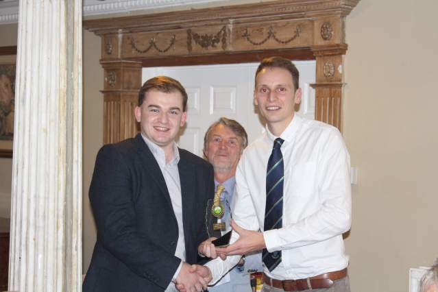 Image of Phillip Benge being presented with the fielder award